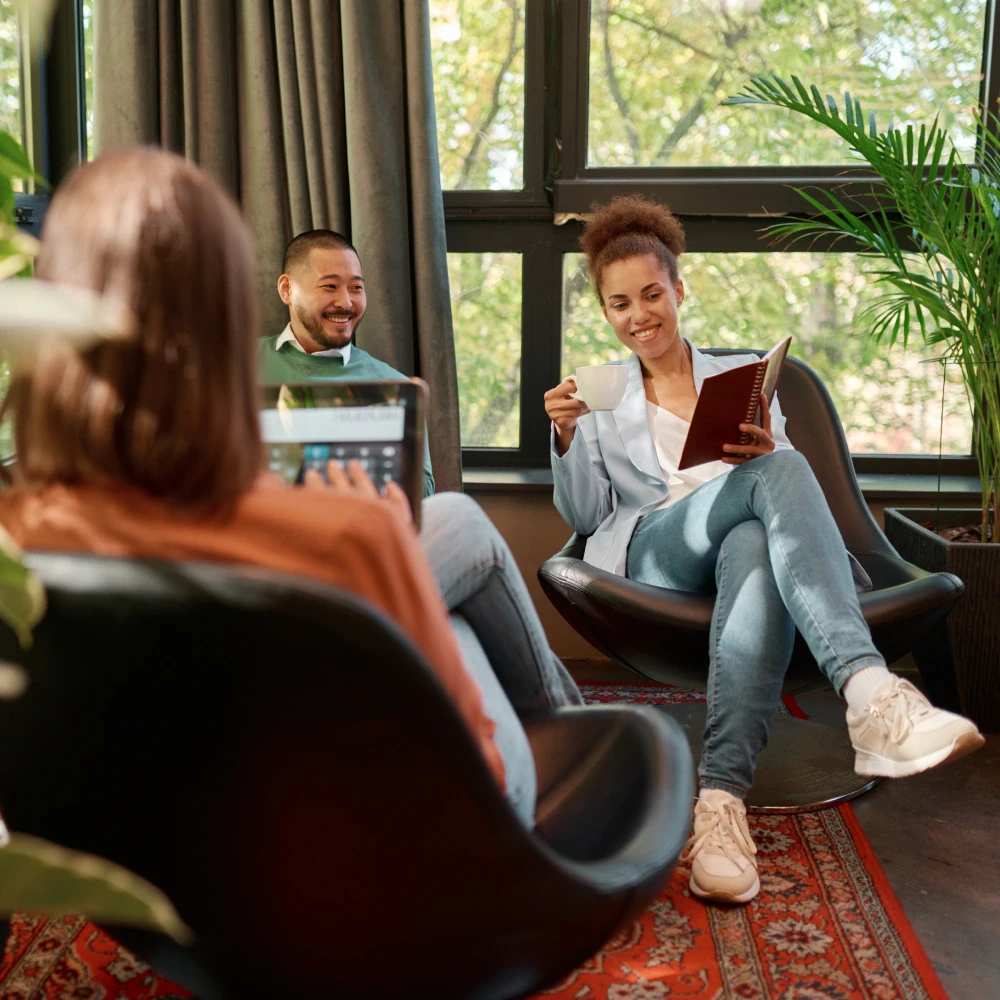 Corporate team building activity in a modern conference room